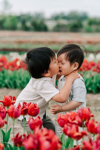 A sweet moment between brothers at Burnside Farms, taken by Denise Van Photography