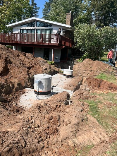 Septic repair next to a house