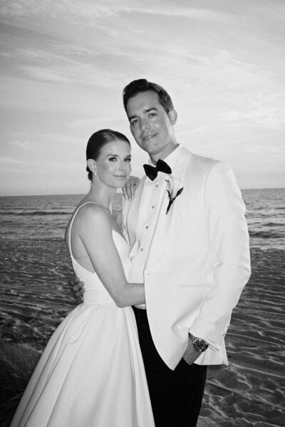 bride and groom smiling taken by photographer in marco island