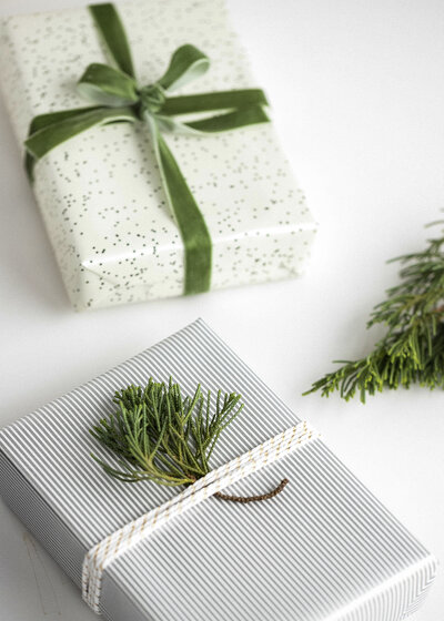gifts wrapped with greenery | carlisledigitalmarketing.com