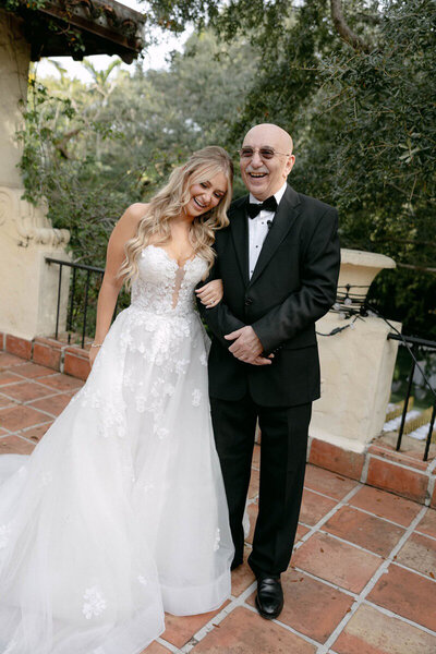 Bride with father on patio taken by orlando photographer, Marissa Nicole