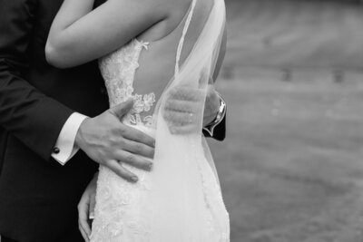 Groom holding his bride during wedding photos in green bay Wisconsin