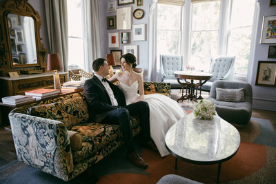 bride and groom sitting together captured by the madrona hotel wedding photographer