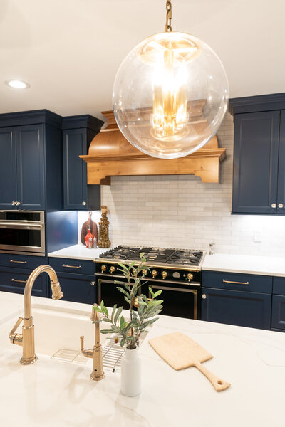kitchen with navy and gold accents