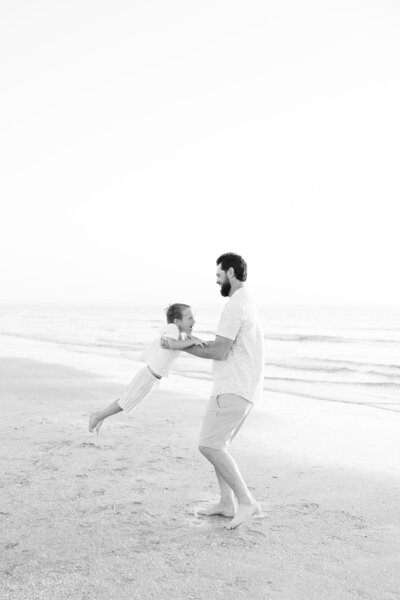 Dad and son dance on the clearwater beach