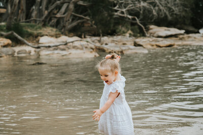 Photo of girl playing in the water  at swan river