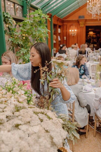 woman picking flowers at the bridal shower
