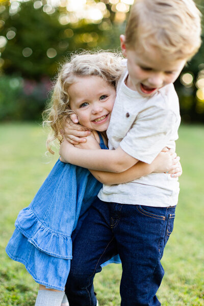 Brother and sister at outdoor family photo session in Birmingham