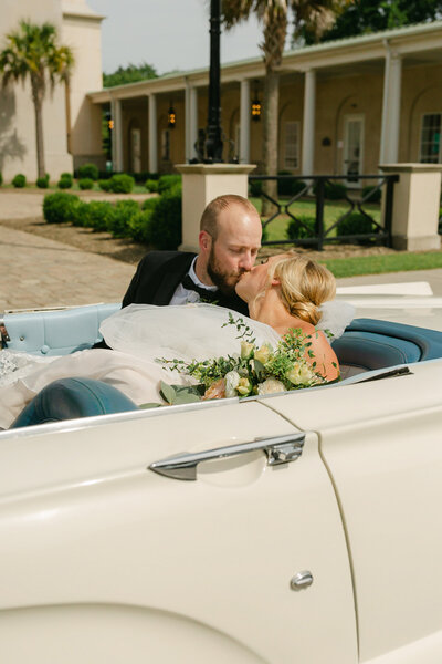 bride kissing flower girl on forehead