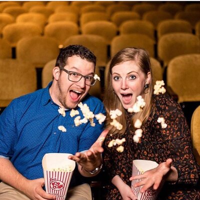 Scott Woofter and wife Jenny throwing popcorn in air