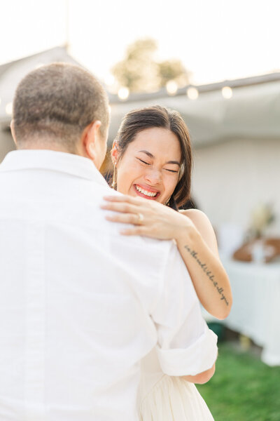 a dad and bride having their first dance 
