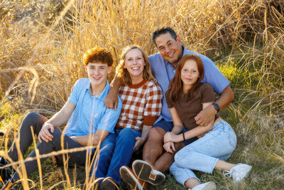 family in fall outfits for outdoor photos