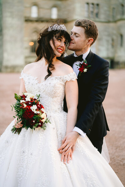 a wedding couple embracing at their wedding in ireland at adare manor