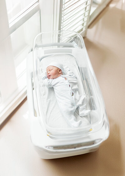 baby boy laying in hospital crib
