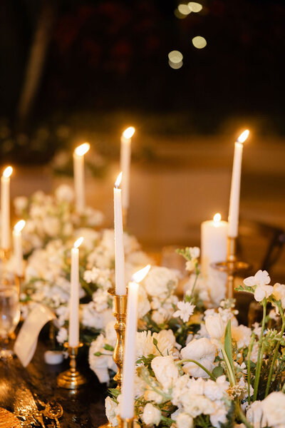 Elegant wedding tablescape with florals and candles