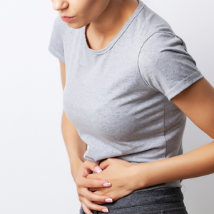 A lady experiencing abdominal pain