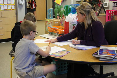 Teacher working with students