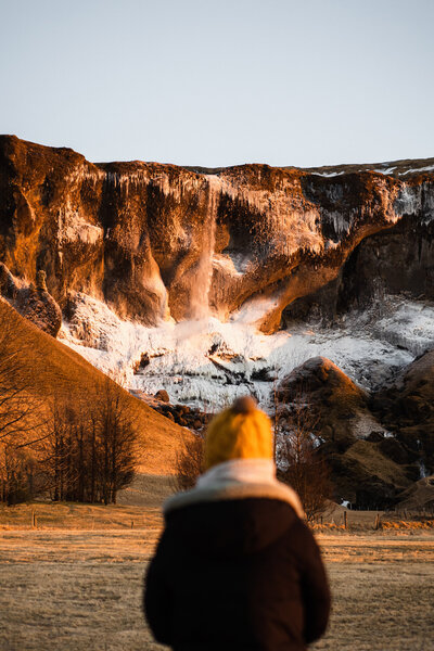 This is a photo of me with a beautiful mountain in the background in Iceland where I was exploring after an intimate elopement
