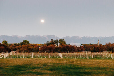 Snowline Acres wedding venue grounds with evening moon in Kalispell, MT