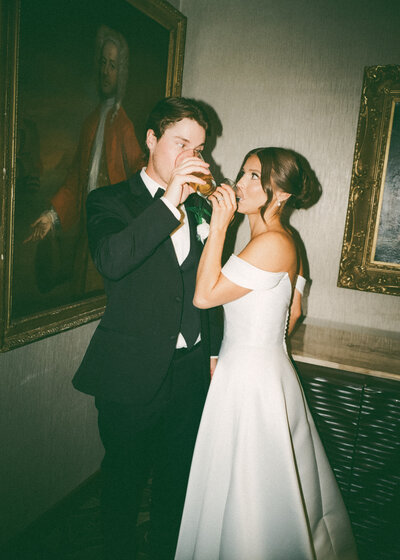 walking down the aisle in warm stained glass light – nostalgic wedding photography