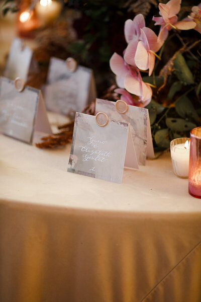 Tented vellum escort cards with silver calligraphy and wax seal for Belle Mer wedding in Newport, Rhode Island