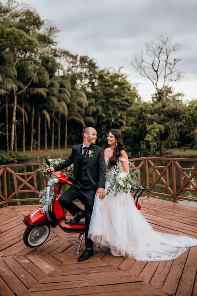 couple on moped in costa rica at their wedding