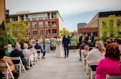 A couple gets married on the rooftop of Loft Lucia