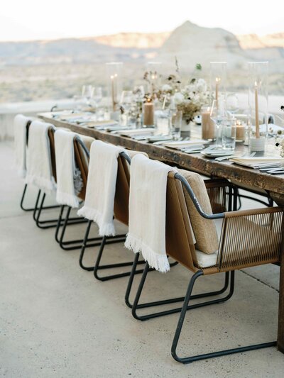 Neutral table setup with candles and florals