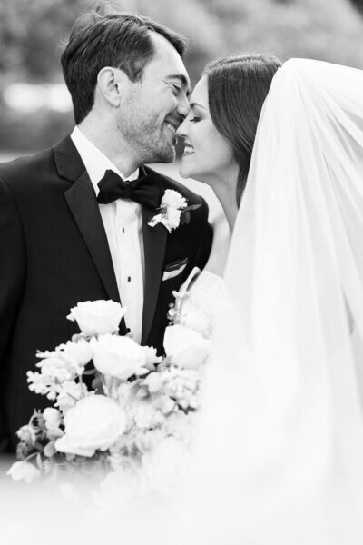 Bride and groom smiling at their outdoor wedding in Houston.