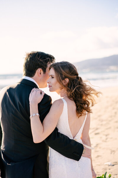 couple posed on Los Angeles beach after wedding
