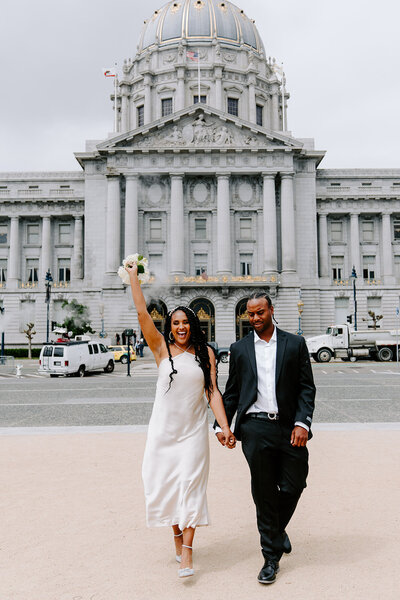 bride and groom in front of mountain