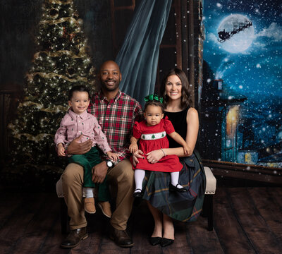 family posed for christmas studio portrait