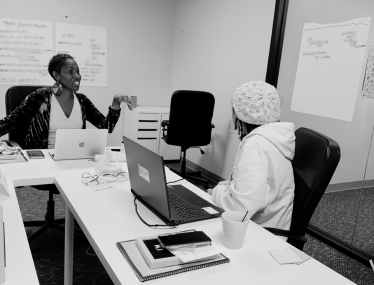 female entrepreneurs working together in community business intensive