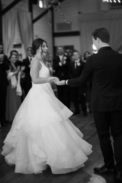 Couple spinning and twirling to swing dance music