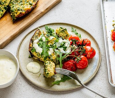 Baked spinach and goat’s cheese frittata with roasted cherry tomatoes and creamy dressing