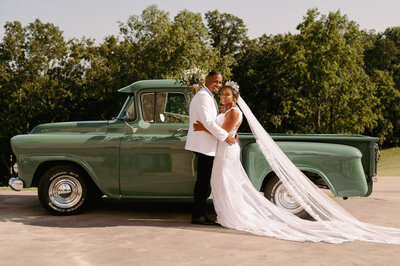 A bride and groom have a dance outside of their churh