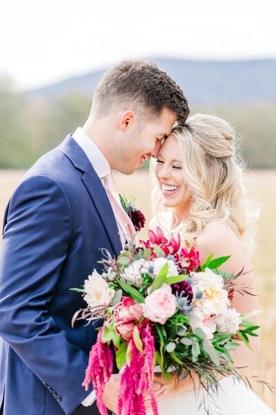 Laughing bride with groom at fall wedding   | Alabama wedding photographer Amanda Horne