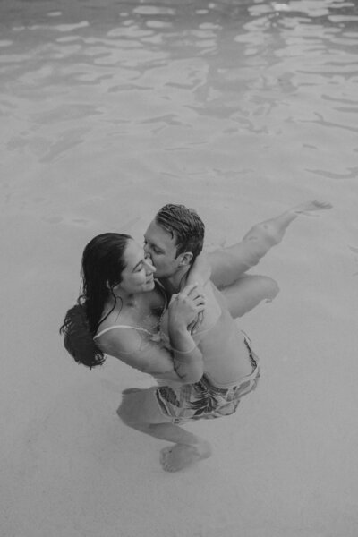 bride & groom joyfully smiling at the camera