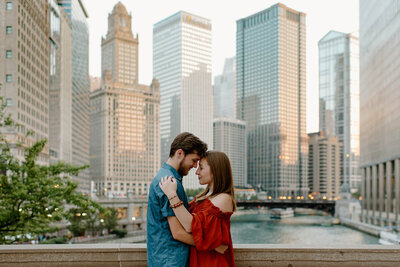 couple hugging in front of cityscape