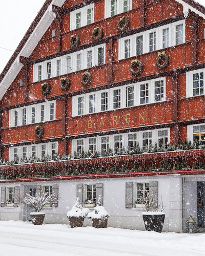 Winter exterior photography of Appenzellerhuus Gonten by Fenja, Swiss hospitality photographer.