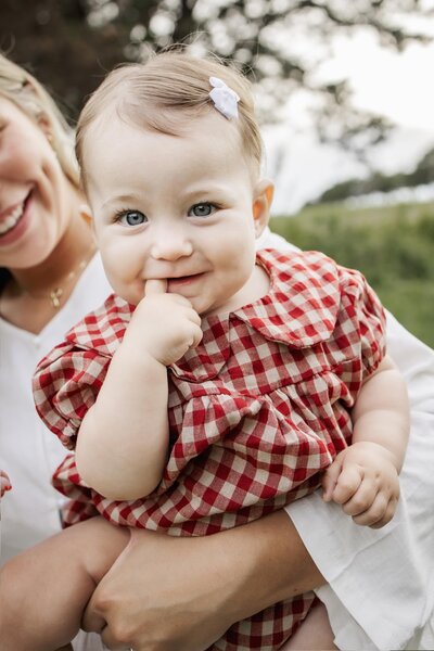 a mom embraces her daughter in the park in the colony texas