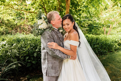Groom kisses bride  on wedding day - Jessica Mummert Photography