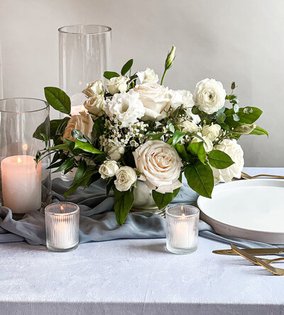 Floral centerpiece in a bowl on a table