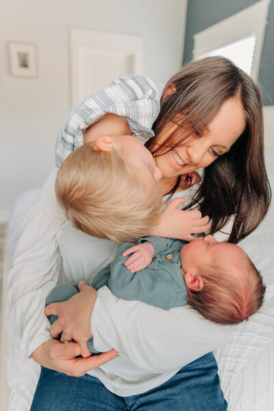 Asheville In-Home newborn session with toddler boy and newborn baby boy hugging on mama with Asheville, Newborn Photographer Rachel Marie Photography