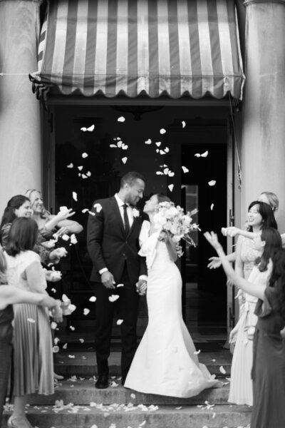 couple shares kiss during wedding reception send-off at the Larz Anderson home in Washington, DC