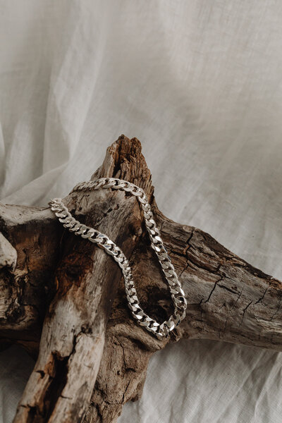 kaboompics_silver-jewelry-wood-and-marble-29623