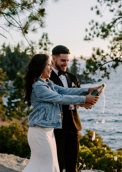 Couple popping champagne in California.