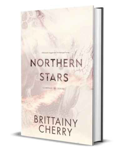 man with beard wearing a white shirt looks down on the cover of the air he breathes by romance author brittainy cherry