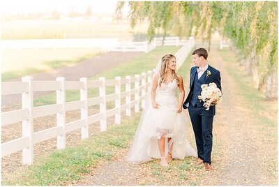Bride and groom wedding portrait walking together by Joni Loraine Photography