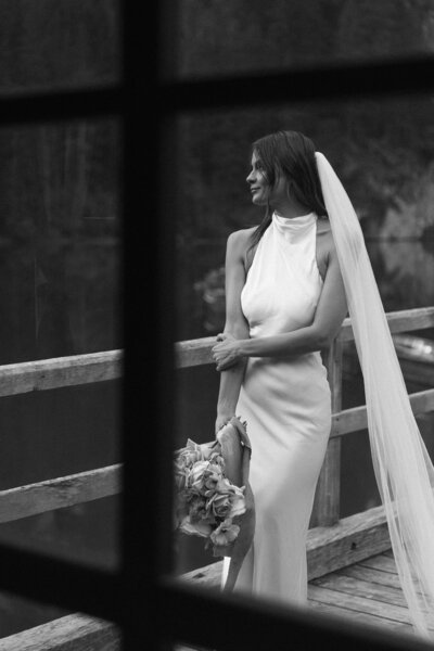 Black and white bridal portrait of bride in modern gown and veil, photographed by a Utah wedding photographer.